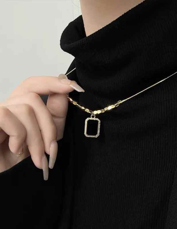 Black Pendant With Gold Beads
