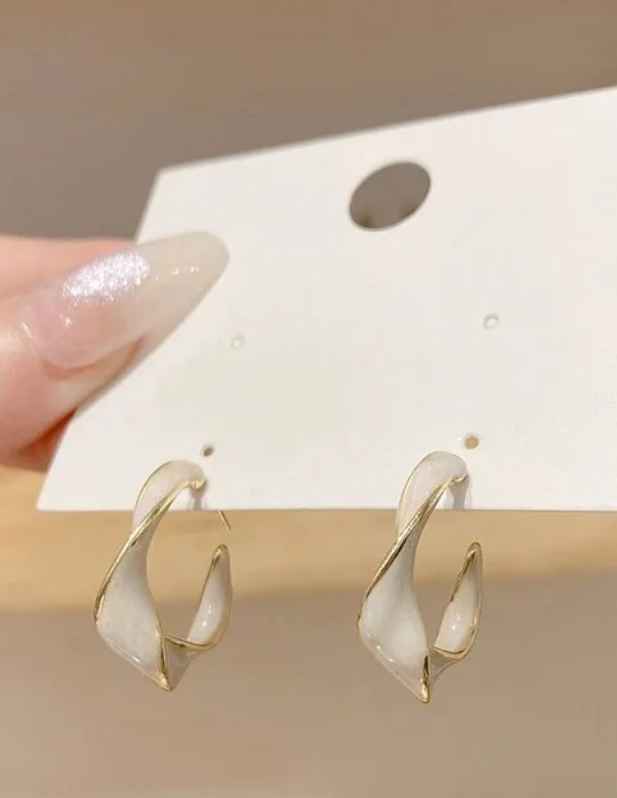 Twisted Hoop Earrings shop now